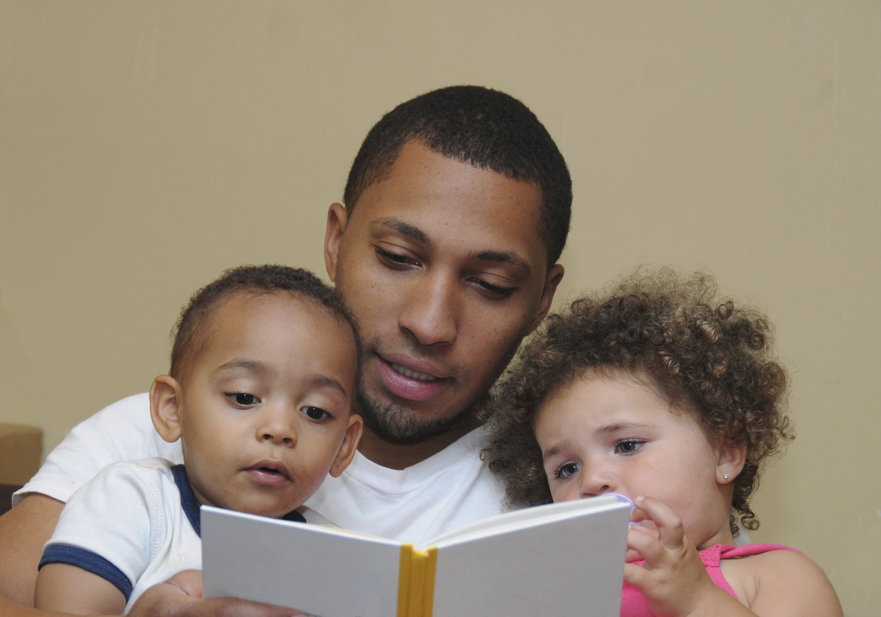 Father Reading to Children Tandem