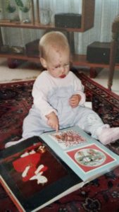 Kelsey as an infant with her grandma-made wordless book